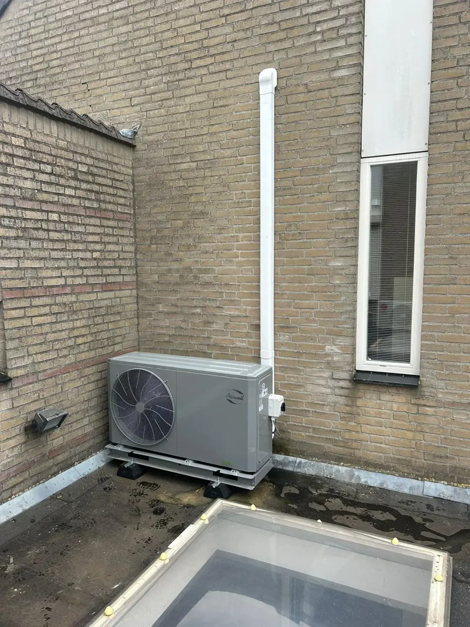 Airwell warmtepomp op plat dak
